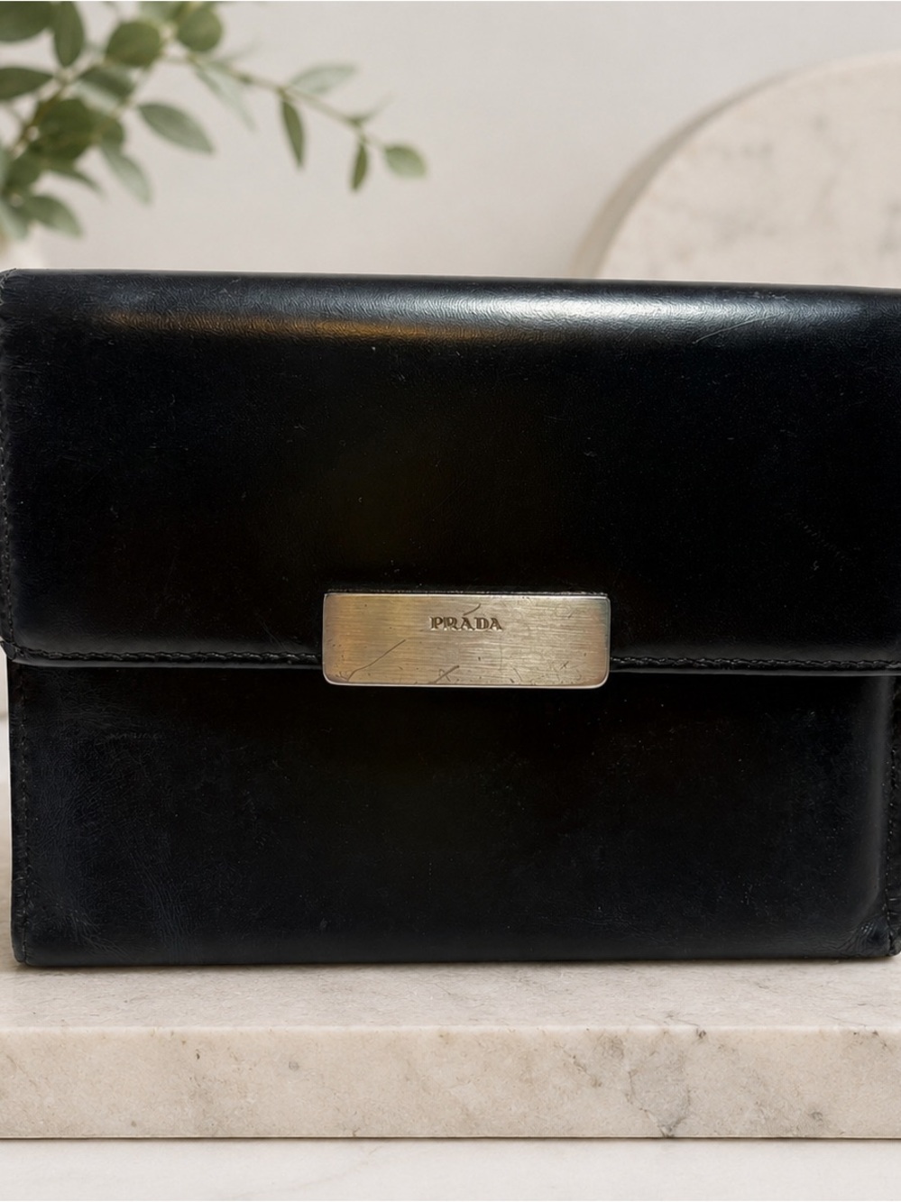 Prada Black Leather Compact Wallet with Silver Name Plate